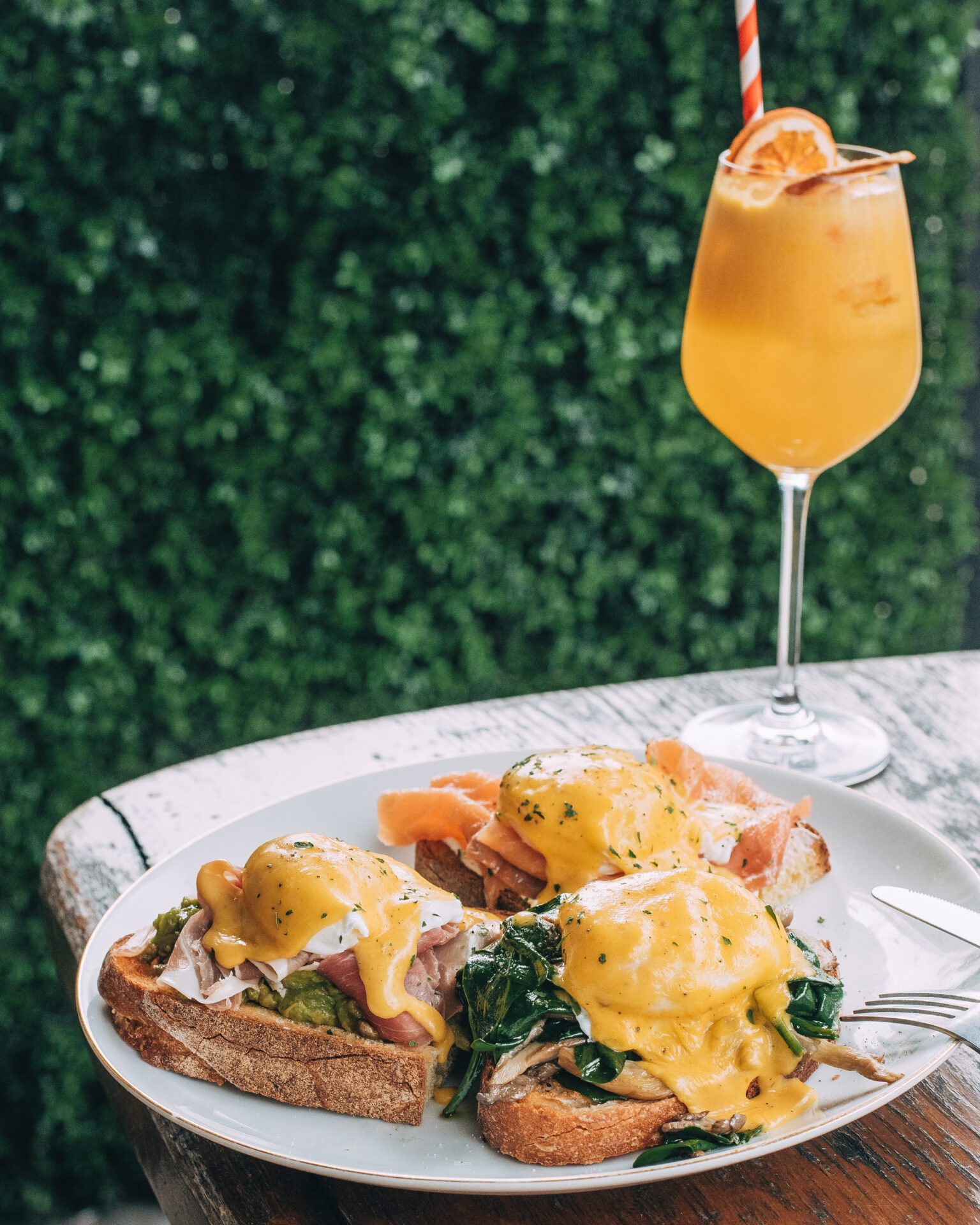 Three eggs Benedict on sourdough with cured ham, smoked salmon and spinach at Casa Tua Kings Cross